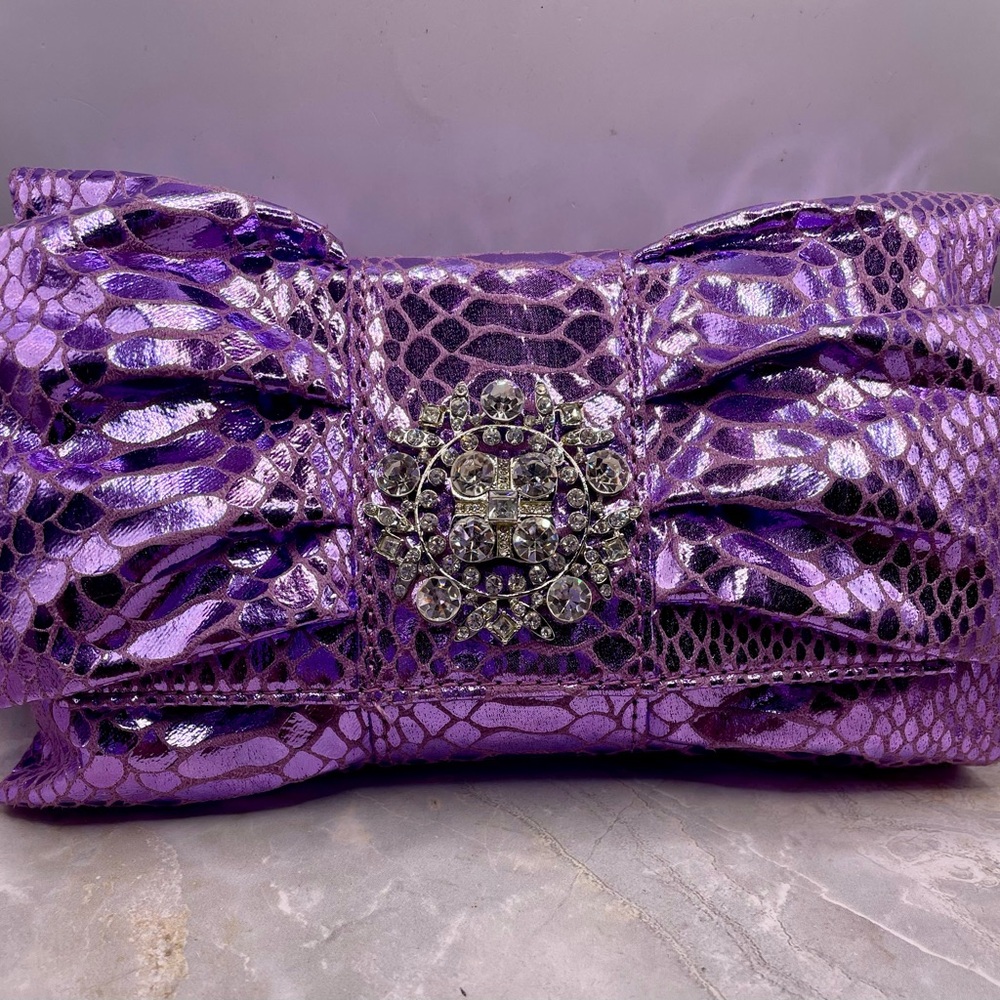 IMAN Purple Faux Snake Skin Bow Clutch with Rhinestone Medallion. 44 inch strap